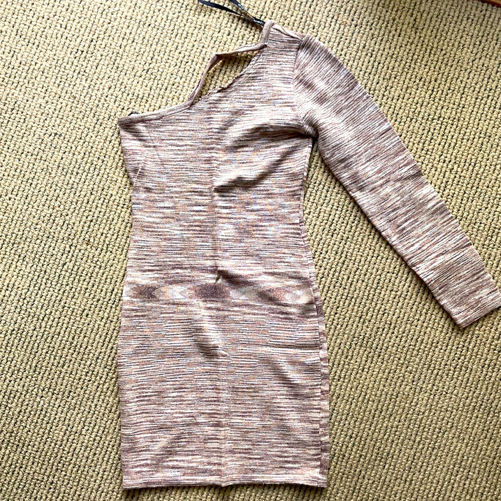 Beige BEBE form fitting one sleeve dress with defect edge unsewn sold AS IS